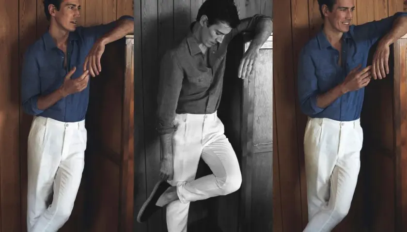 Hombre con camisa azul y pantalón blanco, un look ideal que combinar con pantalón blanco hombre para un estilo veraniego y elegante.