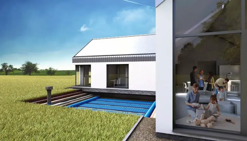 Nowoczesny dom z systemem gwc. Widać rodzinę bawiącą się w środku i podziemne kolektory.