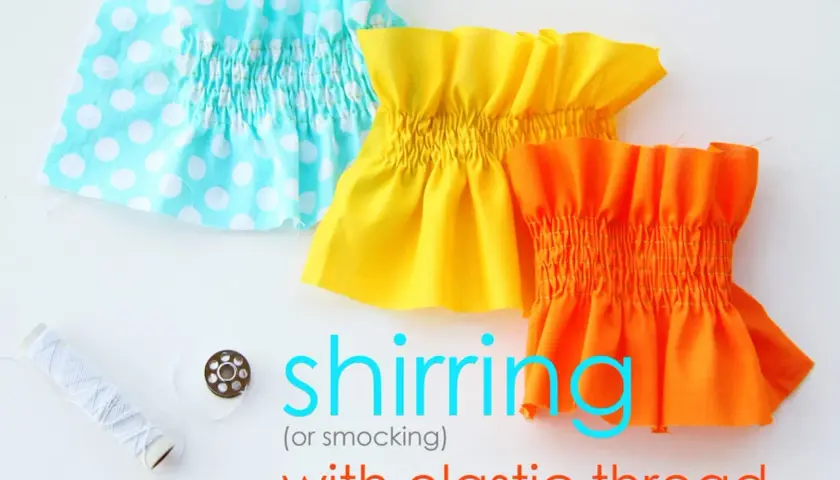 Three fabric swatches with elastic smocking in turquoise polka dot, yellow, and orange. A spool of white thread and a bobbin are nearby.