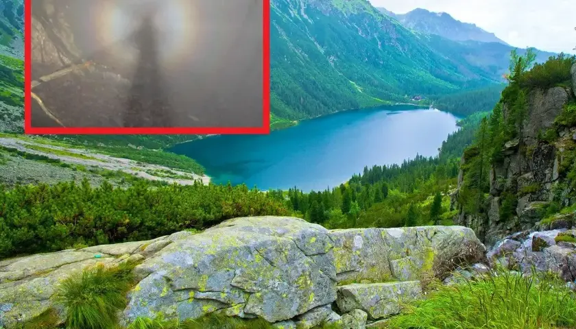 Widok na jezioro w górach, a w powiększeniu tajemnicza sylwetka otoczona tęczową aureolą – to efekt brockenu.