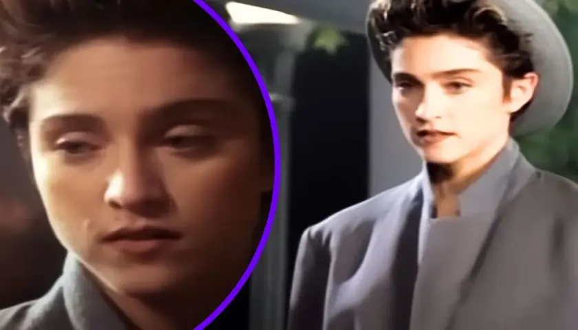 Młoda kobieta w szarym płaszczu i kapeluszu, jak z filmu "La Isla Bonita", zamyślona.
