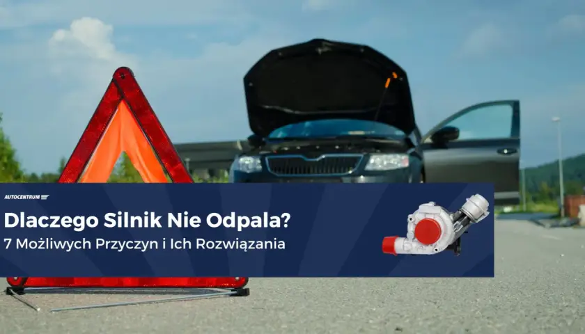 Rozładowany akumulator po dłuższym postoju? Awaryjny trójkąt i otwarty bagażnik czarnego auta sugerują problem z odpaleniem silnika.