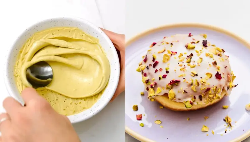 Krem postacjowy pistacjowy w miseczce, obok pączek z lukrem i posypką z pistacji i płatków róży.