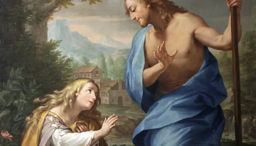 Św. Magdalena, patronka pokutujących, klęczy przed Chrystusem w ogrodzie.