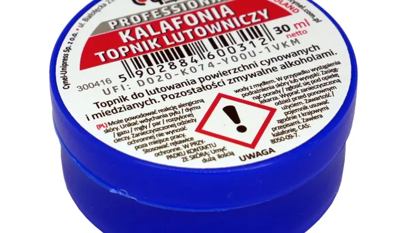 Profesjonalny topnik lutowniczy w niebieskim słoiczku. Etykieta informuje, że jest to kalafonia, co to jest i do czego służy.