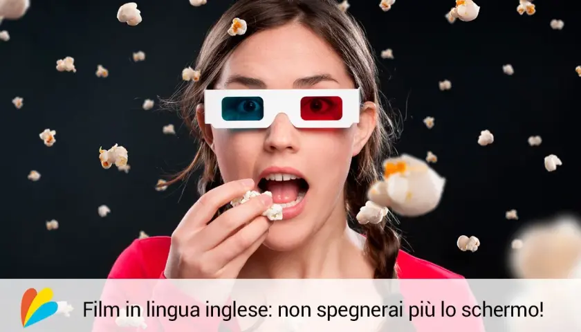 Ragazza con occhiali 3D mangia popcorn, immersa in un film in lingua inglese. Imparare l'inglese non è mai stato così divertente!