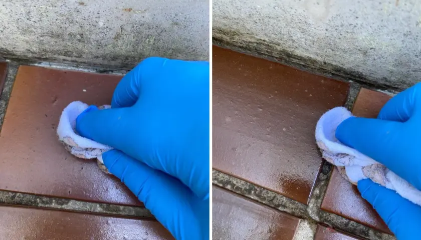 Rękawiczka w niebieskiej rękawicy nakłada środek uszczelniający na fugi balkonowe, chroniąc je przed wilgociącią.