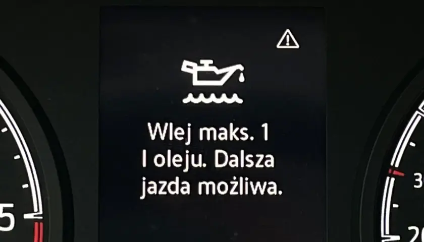 Kontrolka oleju z falą: "Wlej maks. 1 l oleju. Dalsza jazda możliwa." ostrzega o niskim poziomie smarowania.