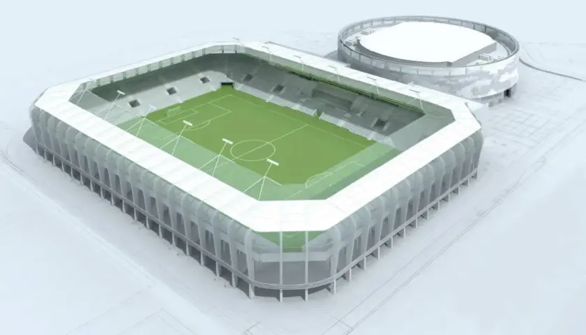Nowoczesny stadion Radomiaka z zieloną murawą i wielopoziomowymi sektorami. Obok obiekt treningowy.