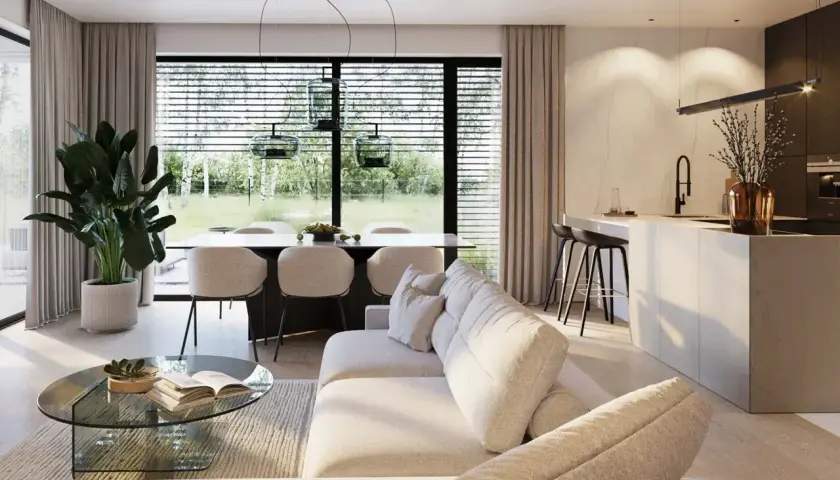 Nowoczesny salon z jadalnią i aneksem kuchennym. Wygodna sofa, szklany stolik i duży stół z krzesłami. W tle okno z widokiem na ogród. homekoncept 133.