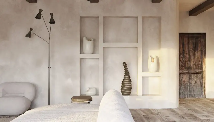Przytulne wnętrze w stylu wabi sabi z drewnianymi belkami, tynkowanymi ścianami i rustykalnymi detalami.