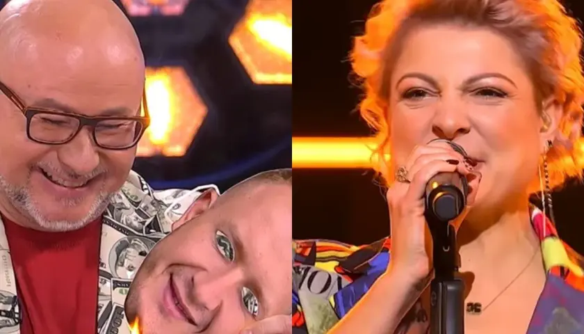 Zabawny moment z programu, gdzie mężczyzna z maską na twarzy zapala ją zapalniczką, podczas gdy kobieta śpiewa. To jak vox piosenki alfabetycznie, ale z humorem.