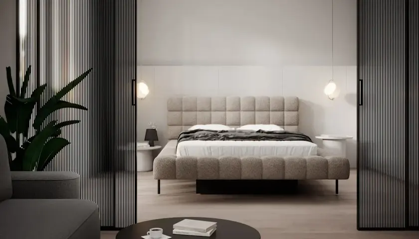 Minimalistyczna sypialnia z tapicerowanym łóżkiem i stolikami nocnymi. Inspiracja, jak umeblować małą sypialnię, by była funkcjonalna i stylowa.