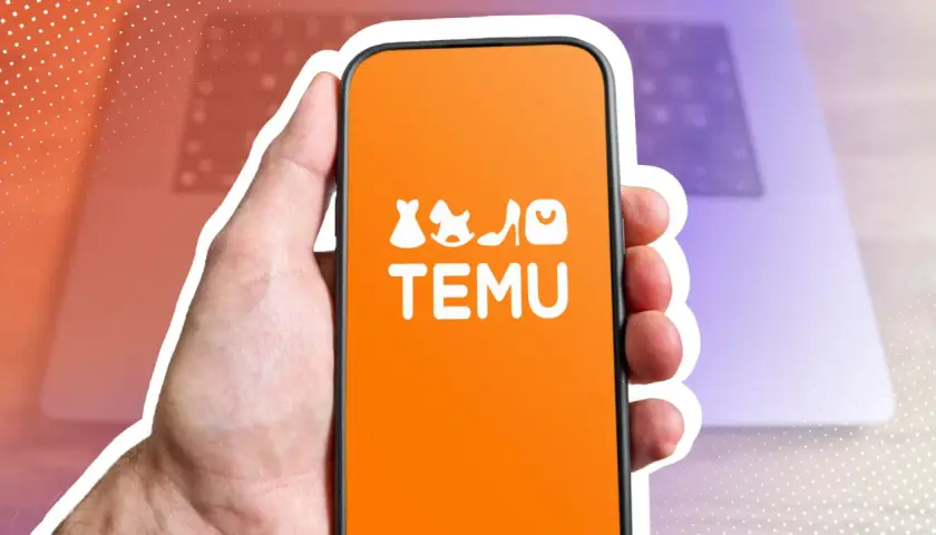 Hand hält Smartphone mit Temu-App. Die App zeigt Modeartikel und den Schriftzug "TEMU". Möglicherweise geht es um den Temu Zoll.