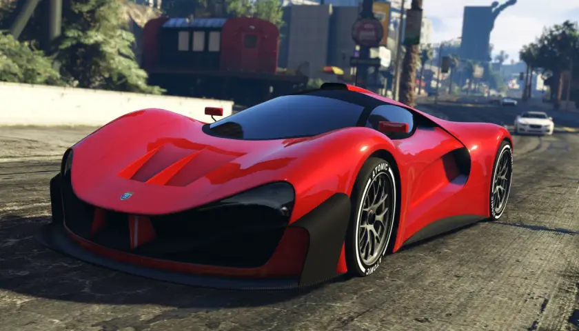 Czerwony supersamochód na drodze w Los Santos. Chcesz szybkich pojazdów w GTA 5? Kody pojazdy mogą pomóc!