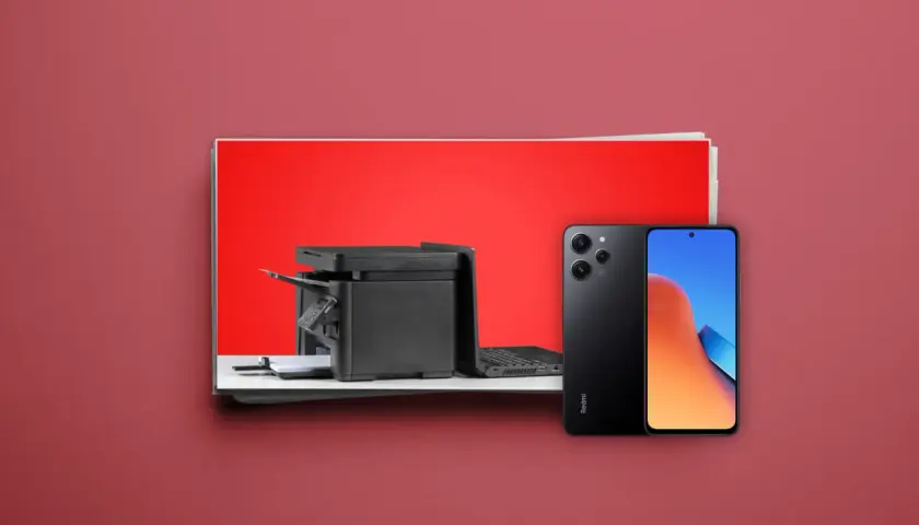 Ein schwarzer Drucker und ein Samsung-Handy liegen nebeneinander. Mit dem Handy kann man Dokumente scannen.