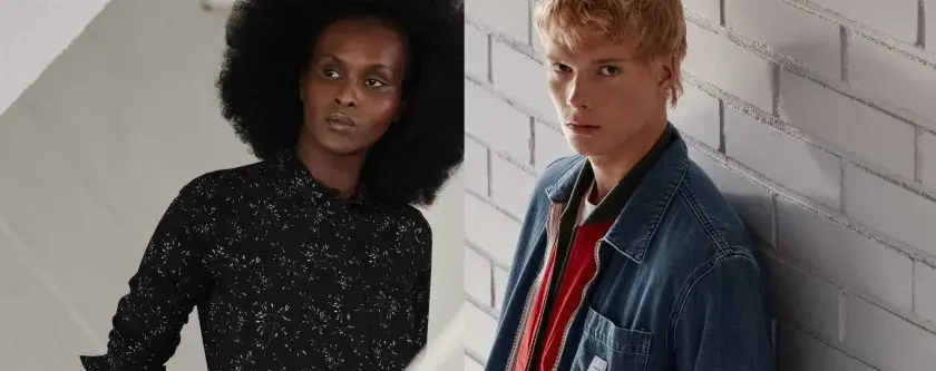 Kobieta w czarnej sukience w białe wzory i mężczyzna w dżinsowej kurtce z czerwoną podszewką, oboje ubrani w stylowe ubrania marki Makia.