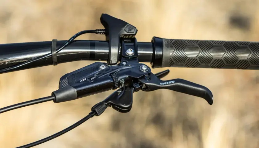 Close-up of a SRAM brake lever with RSC branding, ready for the next trail ride.