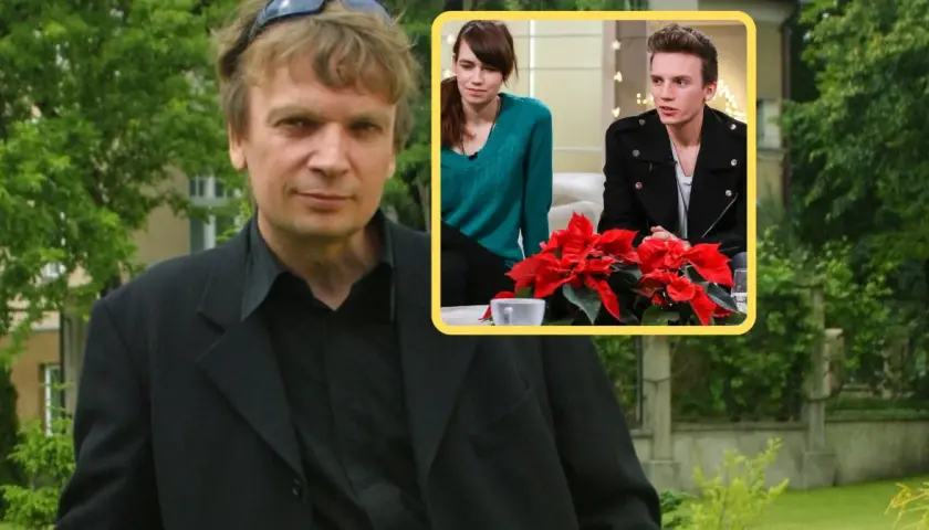 Grzegorz Ciechowski z dziećmi, młodą kobietą i mężczyzną, siedzą przy stole z gwiazdą betlejemską.