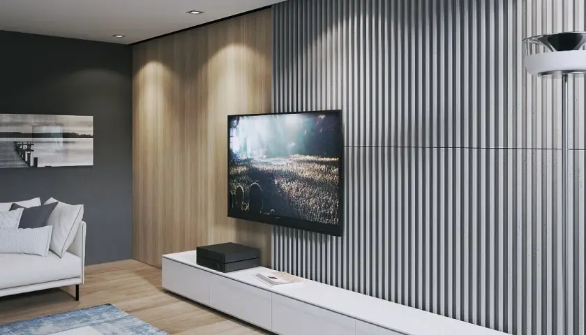Nowoczesna ściana TV: beton i lamele tworzą stylowe tło dla ekranu. Drewniane panele dodają ciepła.