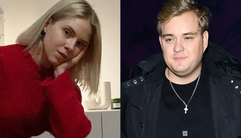 Kobieta w czerwonym swetrze i mężczyzna w czarnej kurtce, przypominający Kevina Mgleja jako dziecko.