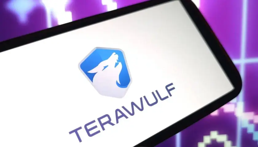 Smartphone zeigt das Logo und den Namen "TERAWULF" vor einem lila Börsenchart. Die Terawulf Aktie im Fokus.