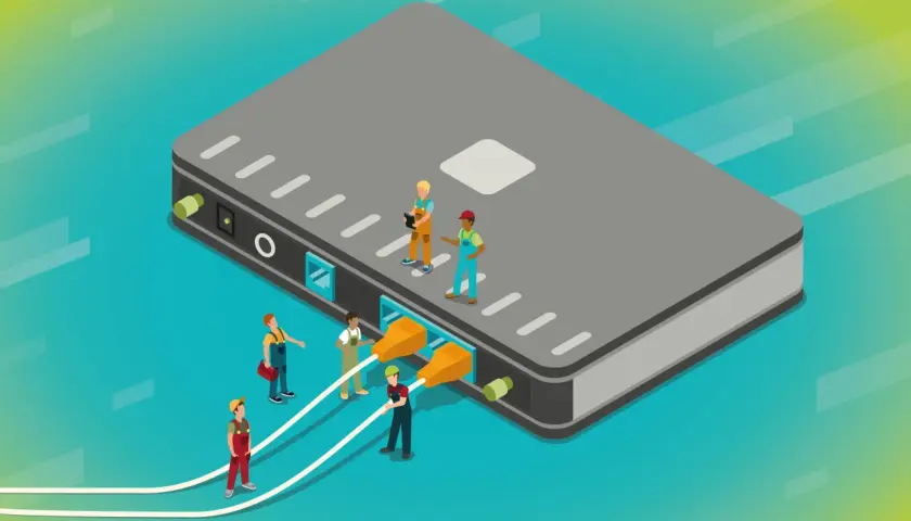 Des ouvriers connectent des câbles à un grand boîtier gris, illustrant a quoi sert un switch : relier plusieurs appareils pour un réseau.