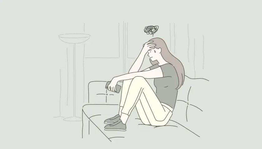 Ragazza seduta sul divano con la mano sulla fronte, pensieri confusi sopra la testa. Non voglio andare dallo psichiatra.