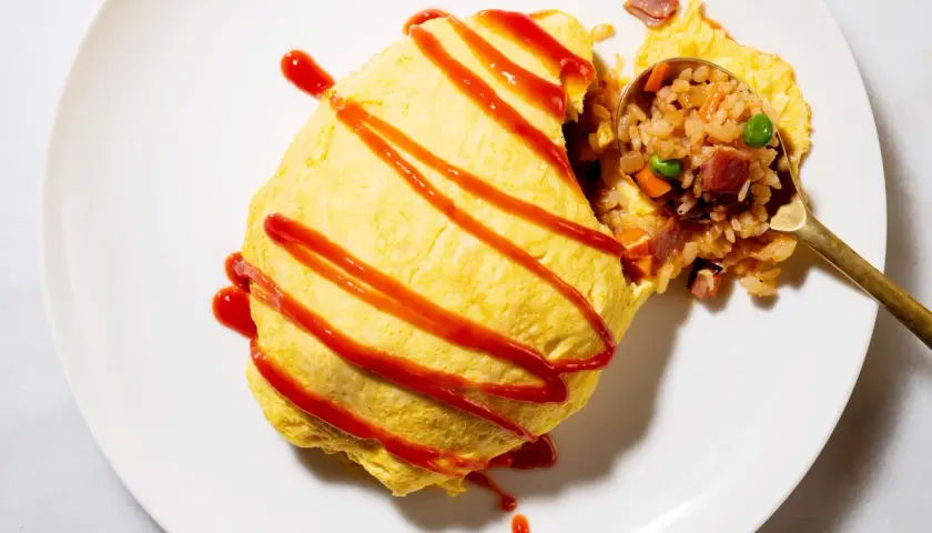 A delicious omurice, drizzled with ketchup. This dish is a popular choice for those curious about omurice calories, offering a satisfying meal.