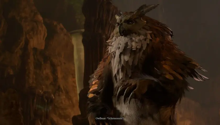 Potężny sowodźwiedź z Baldur's Gate 3, z piórami i pazurami, wydaje przerażający okrzyk w jaskini.