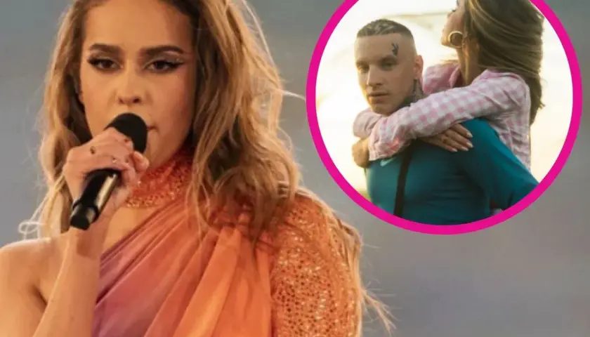 Blanka Stajkow śpiewa, a w kółku jej partner niesie ją na plecach.