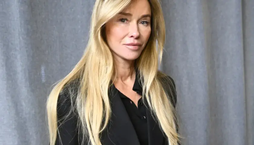 Joanna Przetakiewicz, znana z działalności biznesowej, z długimi blond włosami i w czarnym żakiecie.