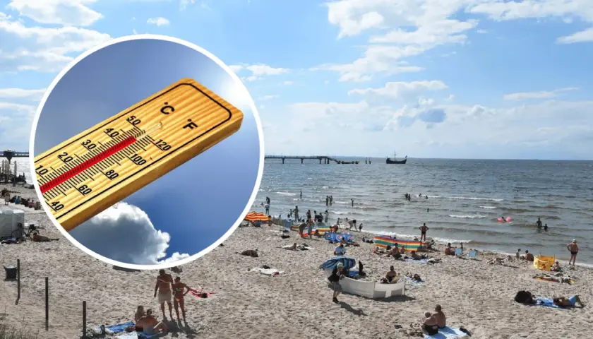 Słoneczna plaża, ludzie kąpią się w morzu. Termometr pokazuje wysoką temperaturę, idealna pogoda na majówkę nad morzem.