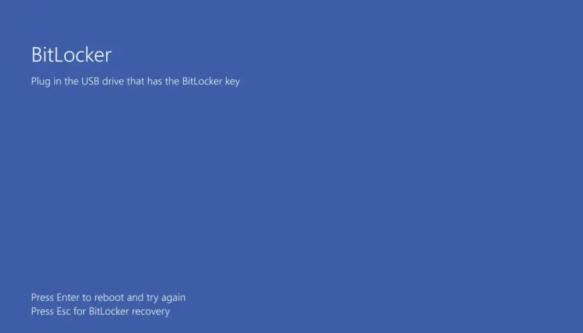 Ekran BitLocker: podłącz USB z kluczem BitLocker. Naciśnij Enter, by spróbować ponownie, lub Esc dla odzyskiwania.
