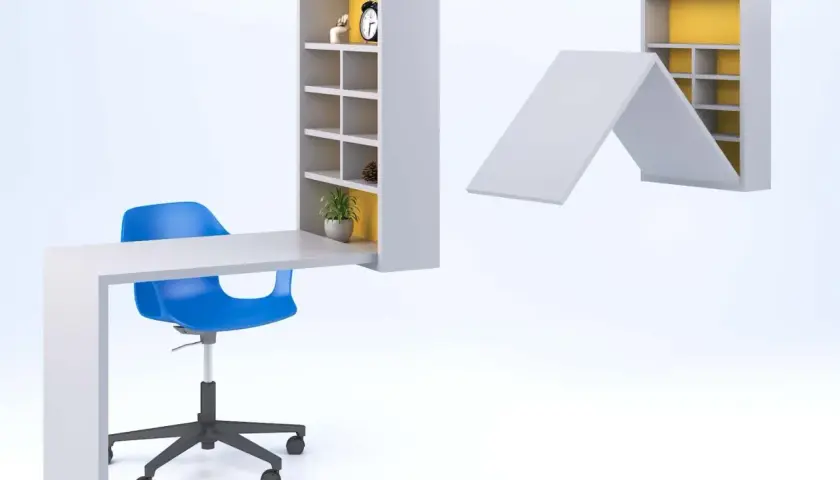 Muebles para manualidades: un escritorio blanco con estantería integrada y una silla azul. Otra estantería se pliega como techo.