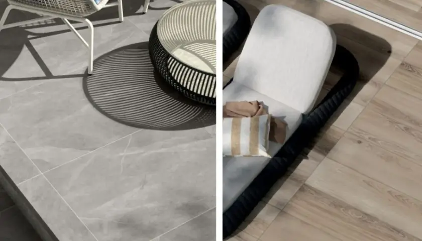 Un'area esterna con pavimentazione in klinker grigio e un lettino prendisole su un pavimento effetto legno.