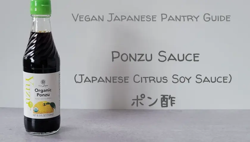 A bottle of Yuzu Organic Ponzu sauce, a tangy Japanese citrus soy sauce, is featured in this vegan pantry guide.