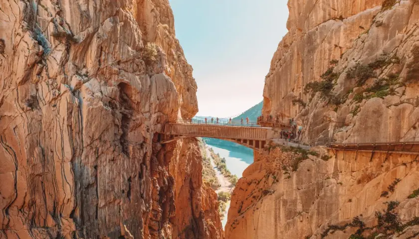 A breathtaking view of the Caminito del Rey, a famous walkway built into the side of a gorge, showcasing incredible walks in Spain.