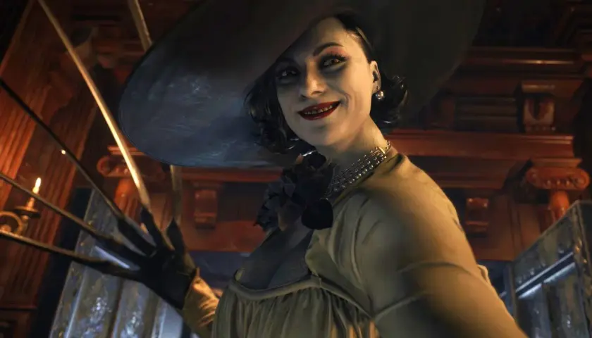 Uśmiechnięta Lady Dimitrescu z Resident Evil Village, która z pewnością należy do najlepszych gier horror. Jej długie pazury są gotowe do ataku.