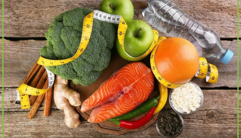 Łosoś, brokuły, jabłka, grejpfrut, imbir, chili i zielona herbata – składniki, które pomogą Ci jak przyspieszyć metabolizm. Miarka krawiecka symbolizuje cel.