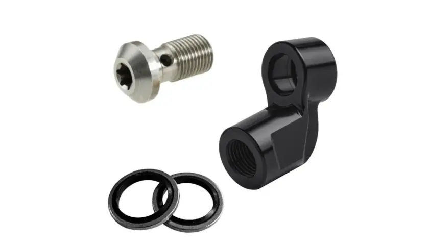 Componenti per freni: vite banjo in metallo, adattatore nero e due rondelle. Utili per creare risers personalizzati.