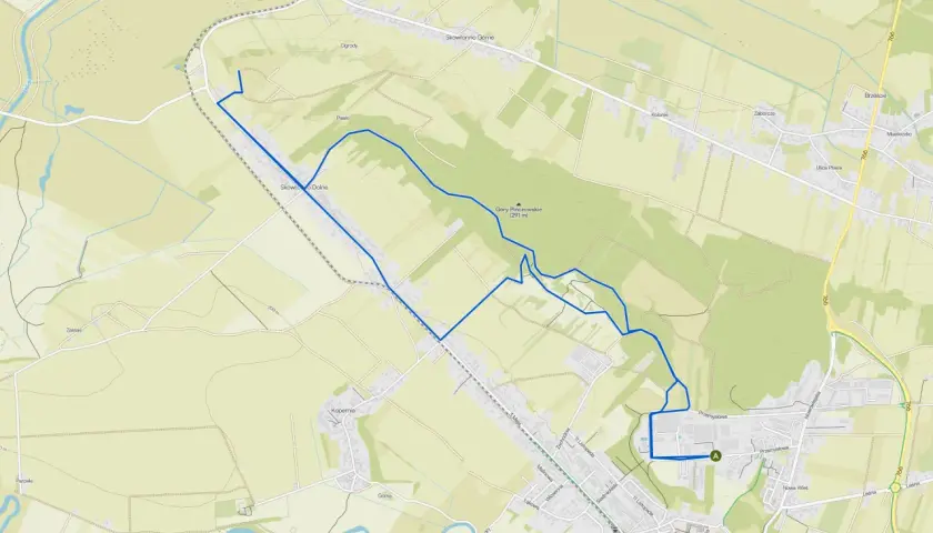 Mapa turystyczna z zaznaczonymi szlakami pieszymi w Górach Świętokrzyskich. Trasa prowadzi przez malownicze tereny, w tym okolice Góry Pińczowskiej.