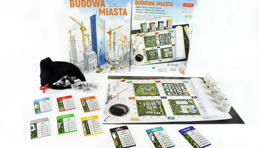 Gra planszowa "Budowa Miasta" z elementami do budowania, kartami obiektów i planszą.