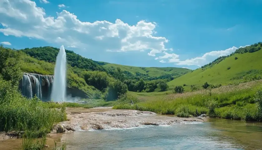 Wodospad i gejzer w bujnej dolinie. Czy to Stara Płanina, jedna z gór w Bułgarii?