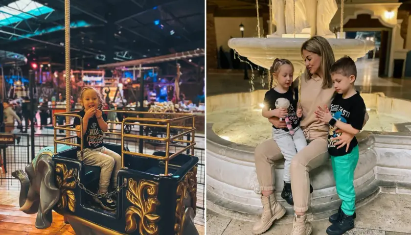 Rodzina korzysta z atrakcji dla dzieci łódzkie zimą. Dzieci bawią się na karuzeli w kształcie słonia i odpoczywają przy fontannie.