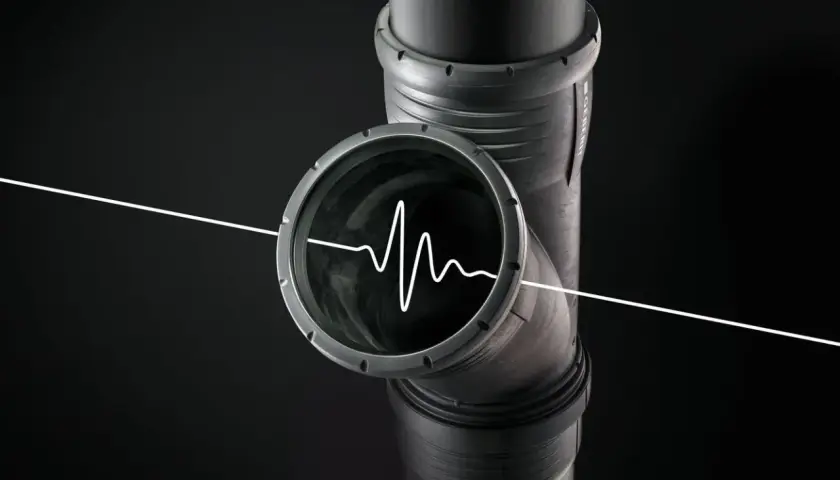 Un tubo di scarico con un'onda sonora bianca all'interno, che illustra perché lo scarico del bagno fa rumore.
