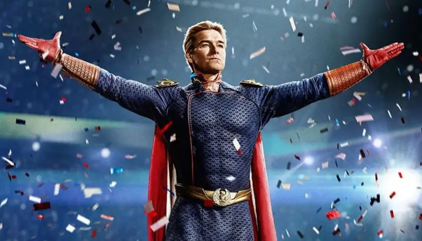 Homelander, en costume bleu et rouge, bras écartés sous une pluie de confettis. L'attente de the boys saison 5 date de sortie est insoutenable.