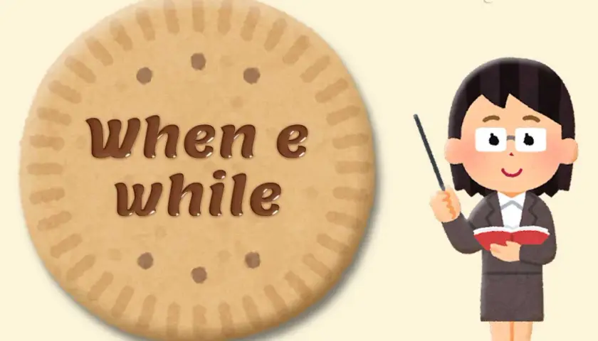 Un biscotto con scritto "when e while" accanto a un'insegnante che spiegava la grammatica inglese.