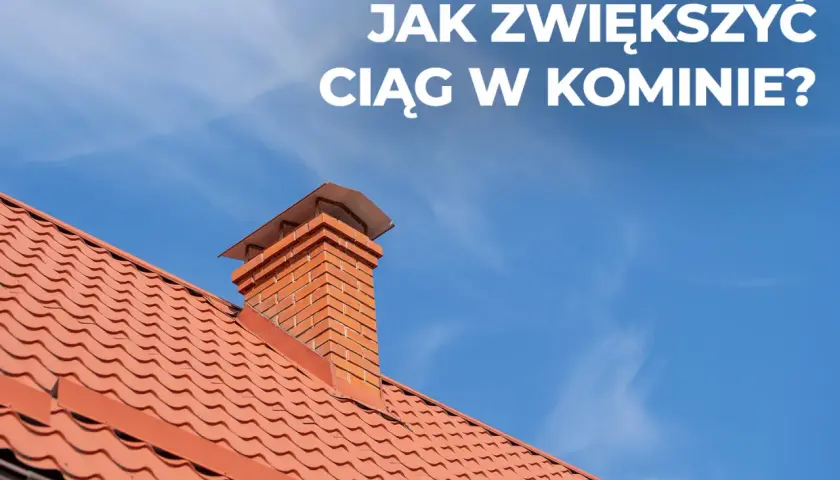 Ceglany komin na czerwonym dachu pod błękitnym niebem. Dowiedz się, jak poprawić ciąg w kominie, by ogrzewanie działało sprawniej.