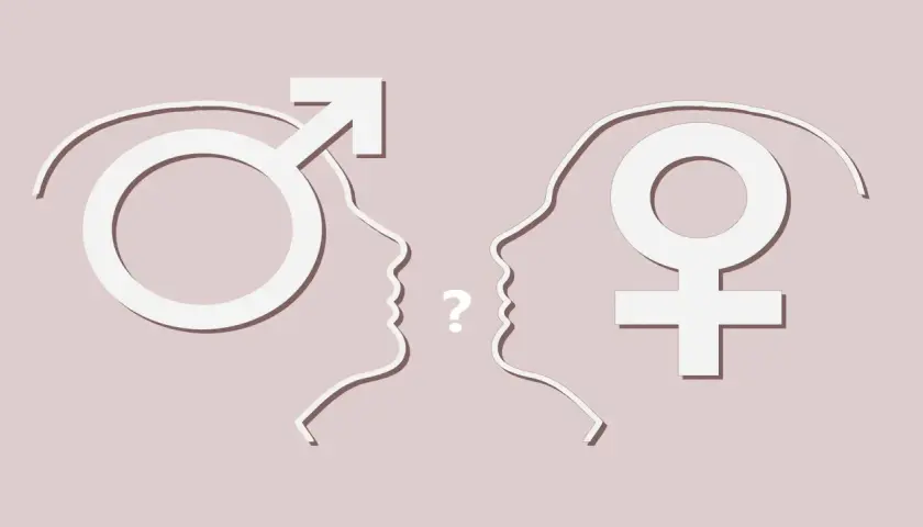 Profili stilizzati di uomo e donna si fronteggiano, un punto interrogativo tra loro. Simboli di genere e dubbi sull'identità, forse la paura di essere gay.